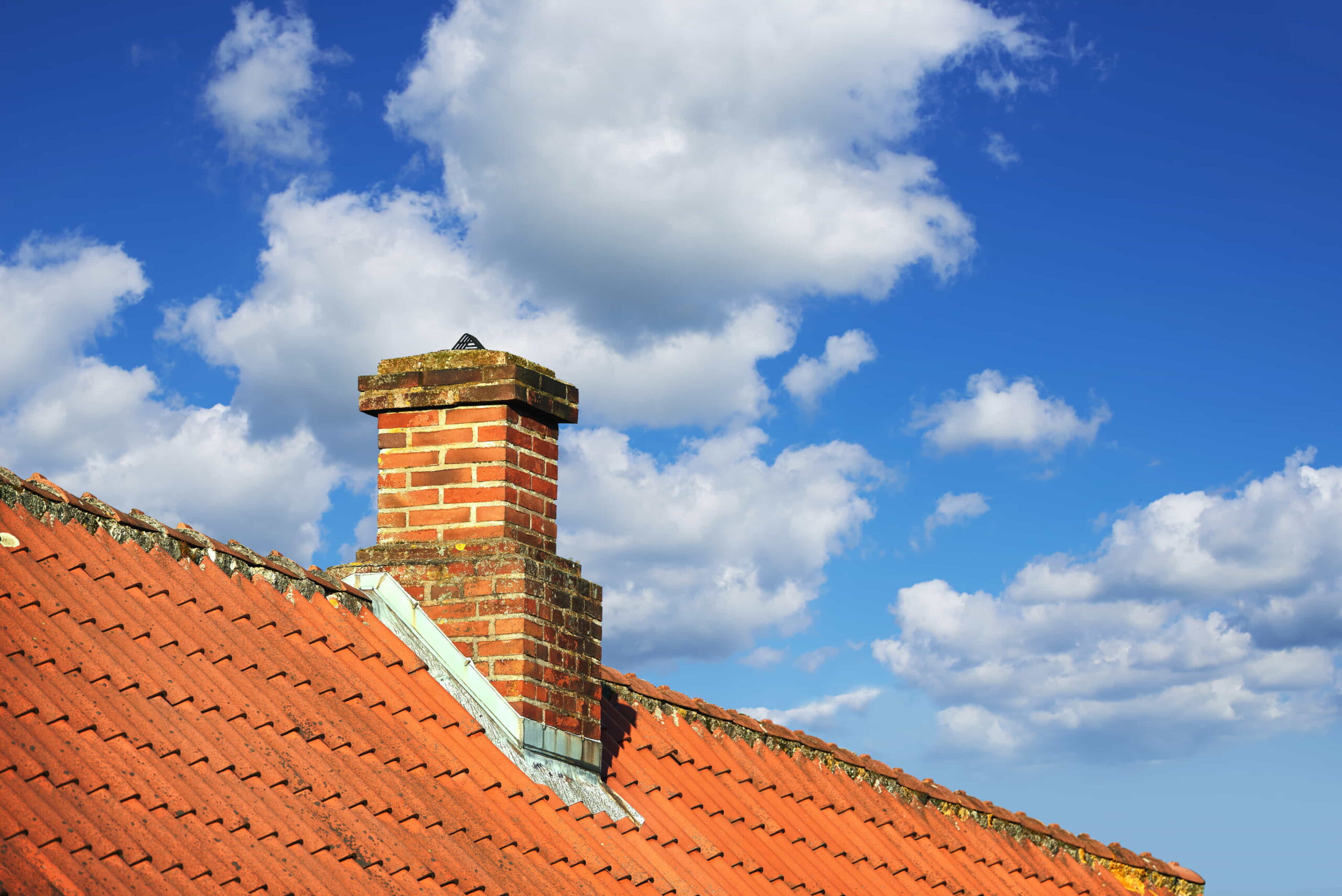 a brick chimney on a roof